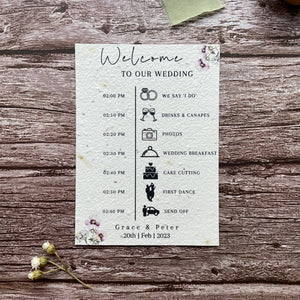 plantable seed paper wedding order of service card in lilac theme, showing front view, floral design on wooden background, eco-friendly