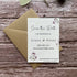 plantable wedding save the date cards with lilac flowers on a wooden surface