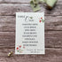 plantable seed paper wedding table seating plan in sweet pea theme, front view with floral design on wooden background, eco-friendly, alakartcreations