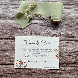 plantable seed paper wedding thank you cards in burnt orange theme, showing front view, floral design on wooden background, eco-friendly