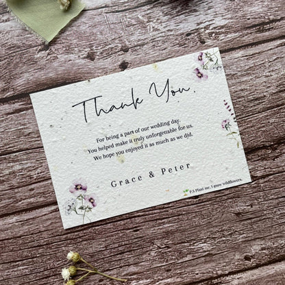 plantable seed paper wedding thank you cards in lilac theme, angled view with floral design on wooden background, eco-friendly, alakartcreations