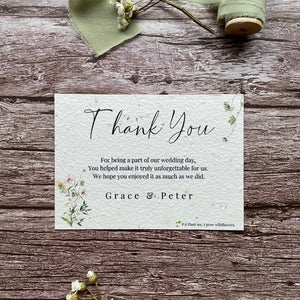 plantable seed paper wedding thank you cards in spring green theme, showing front view, floral design on wooden background, eco-friendly