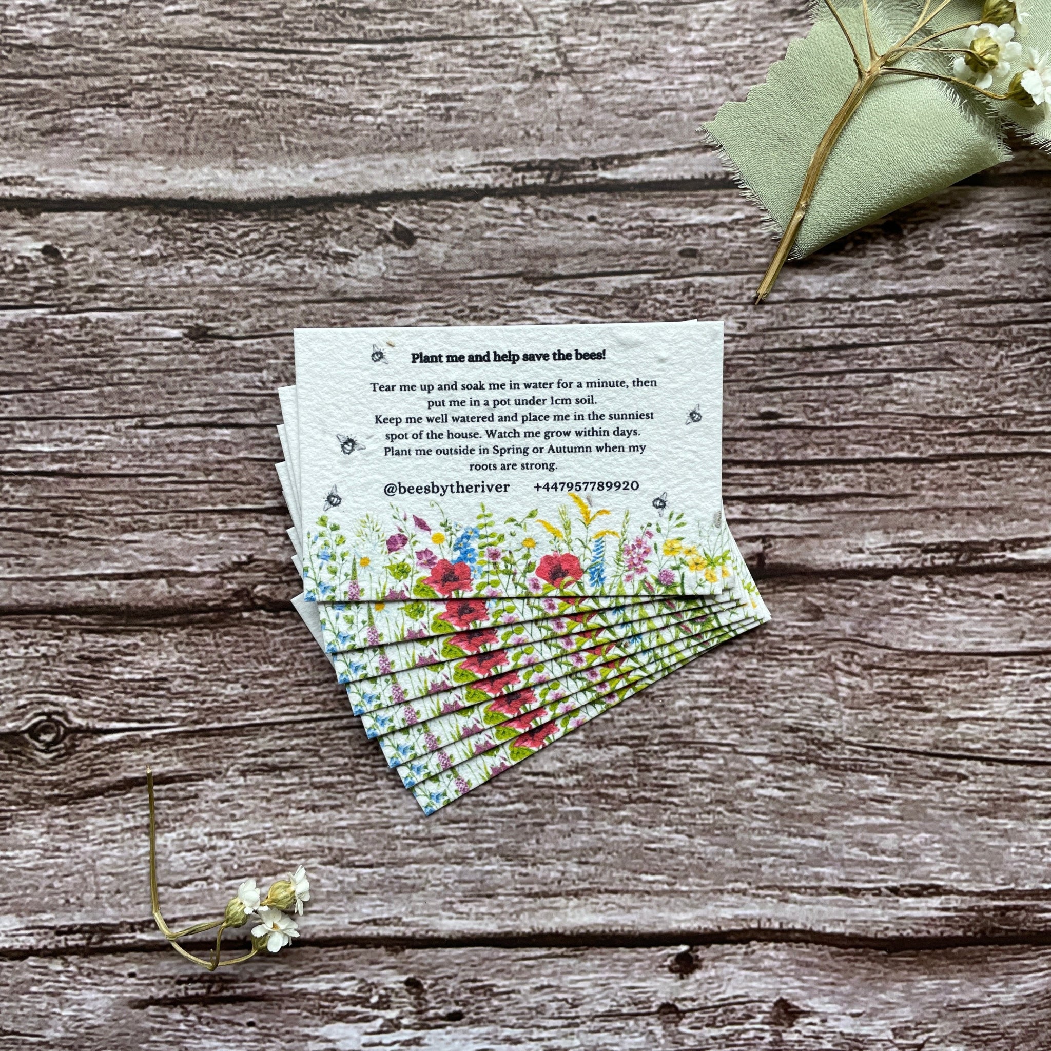 plantable business cards made from seed paper embedded with uk wildflowers, showcasing eco-friendly design, from alakartcreations