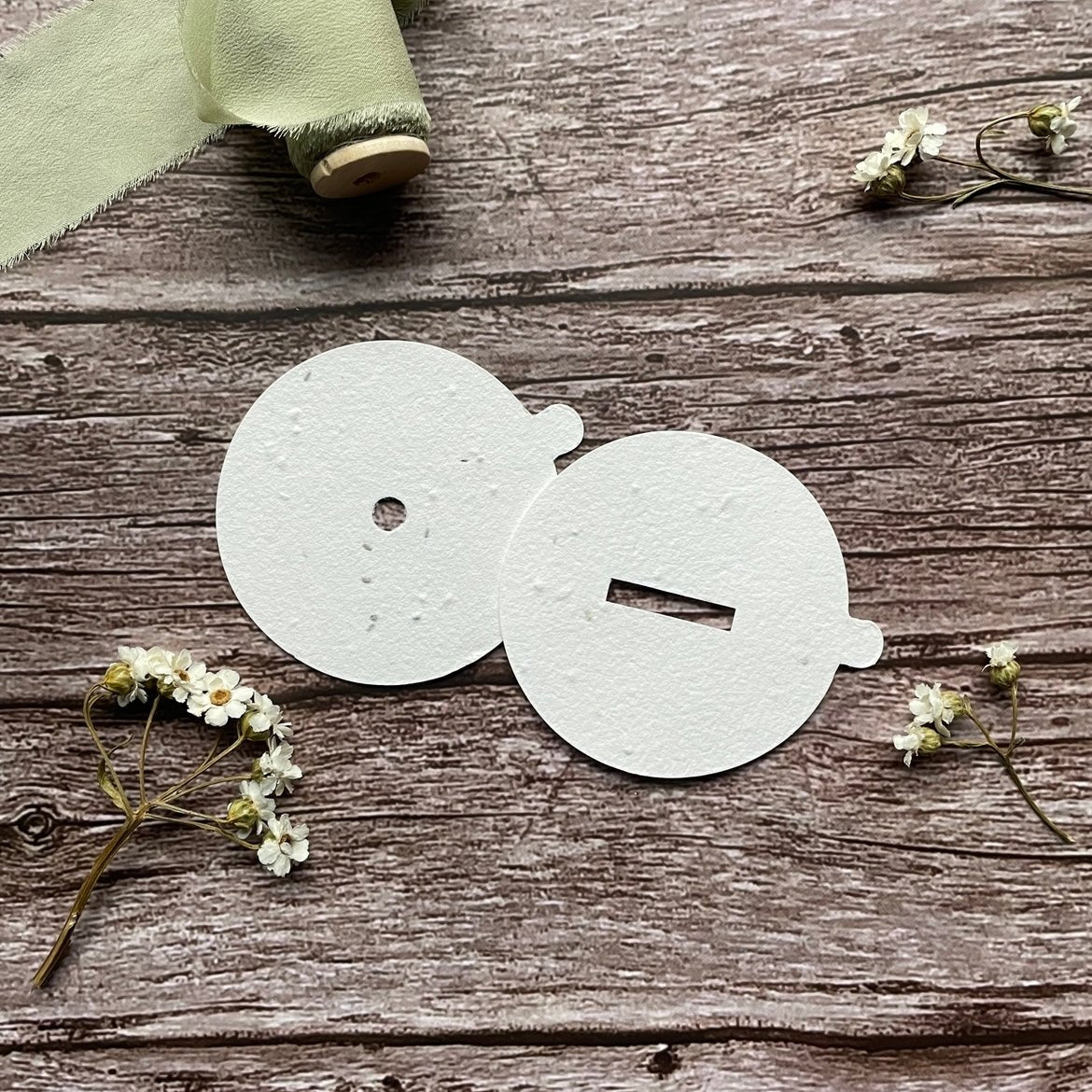 Seeded paper plantable blank candle dust covers that bloom into UK wildflowers when planted. Eco-friendly packaging for candles, handmade in the UK. alakartcreations