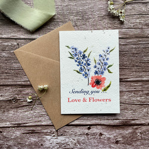 Front view close-up of the 'Sending Love and Flowers - Blue' personalised plantable card featuring a blue floral design. Eco-friendly seed paper card by A La KArt Creations.