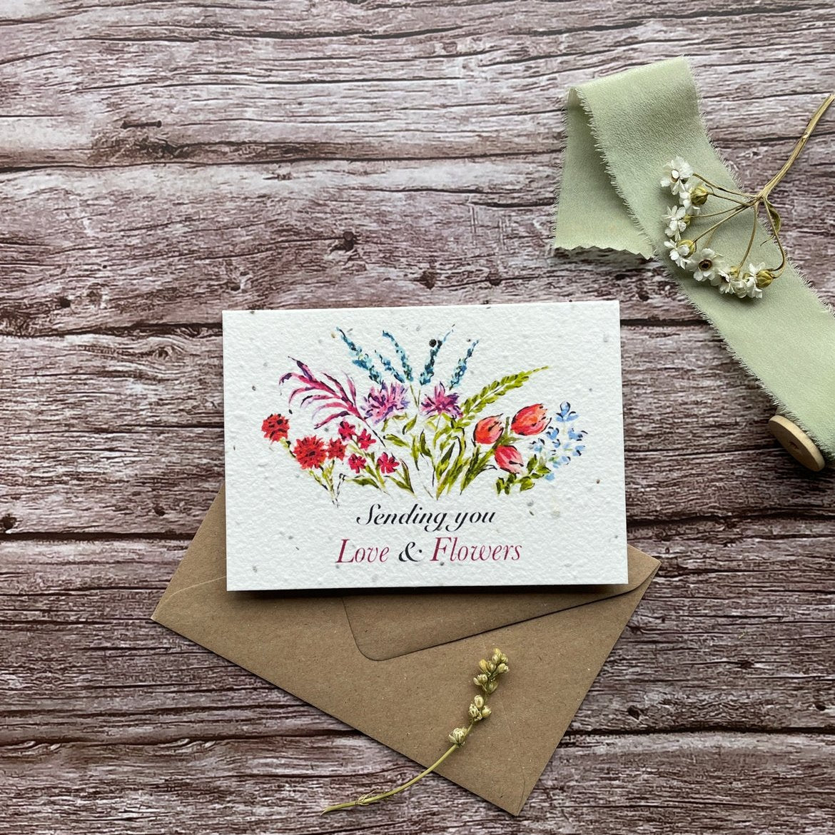 Front view of the 'Sending Love and Flowers' personalised plantable card featuring a vibrant floral design. Eco-friendly, seed paper card by A La KArt Creations.