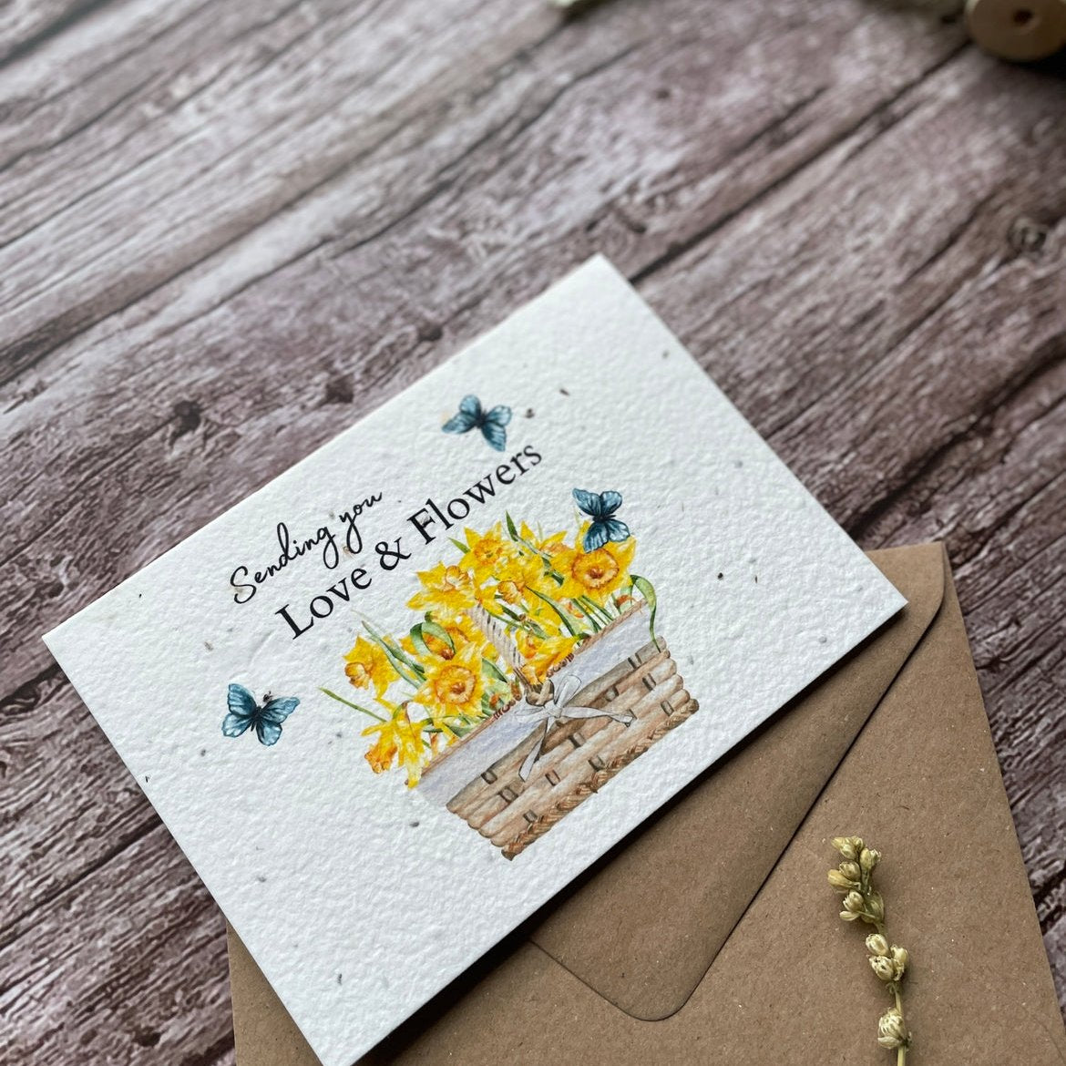 Angled left view of Sending You Love & Flowers Personalised Plantable Card, highlighting the daffodil details.